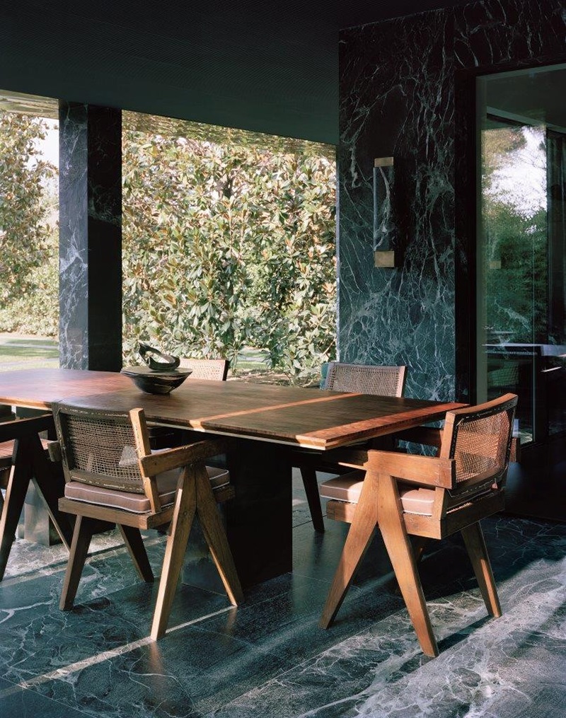 Green Marble House in Forte dei Marmi by Vincenzo De Cotiis. Furniture & Coatings: Pierre Jeanneret Dining Chairs; Verde Alpi Marble